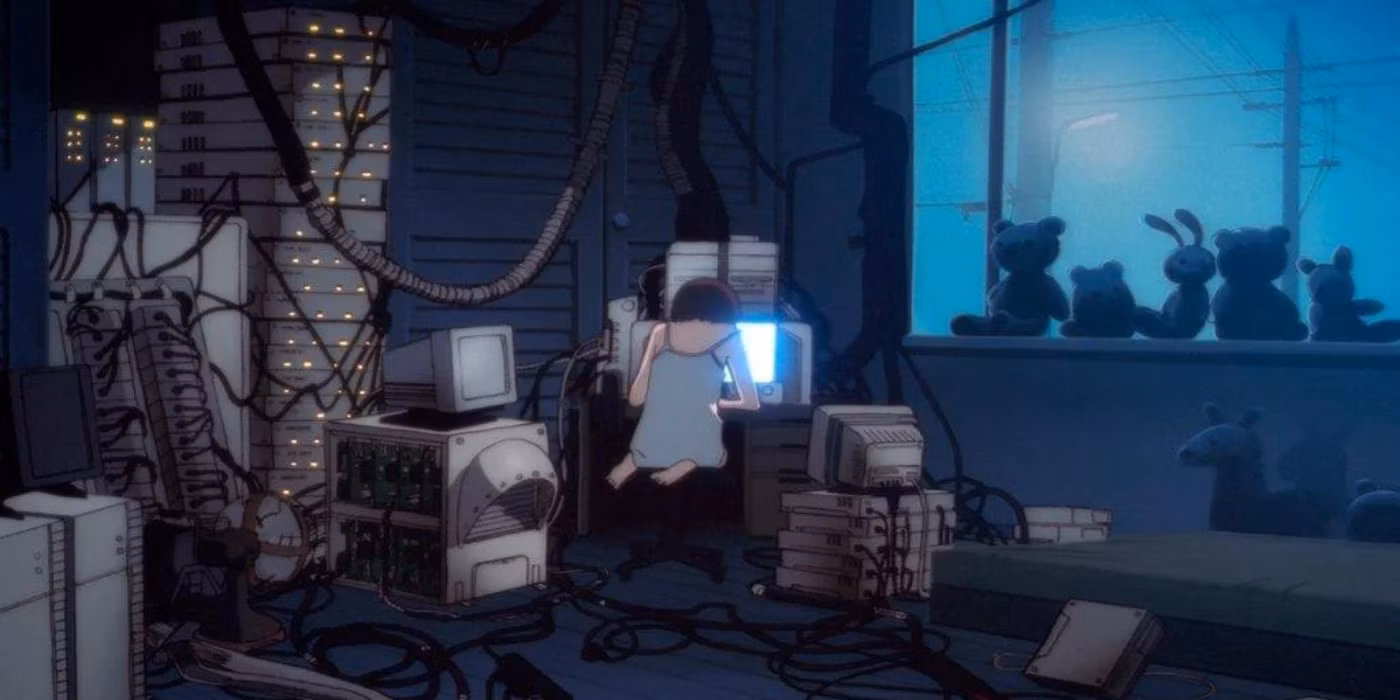 Lain seated before a glowing screen in a room filled with connected computers